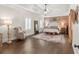 Comfortable and spacious main bedroom with a chair and light, creating a peaceful and inviting space at 31 Copper Leaf Ct, Villa Rica, GA 30180