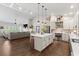 Spacious open concept with kitchen island, hardwood floors, and a fireplace in the living room at 31 Copper Leaf Ct, Villa Rica, GA 30180