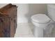 Bathroom with white toilet and rustic wooden cabinet at 31 Copper Leaf Ct, Villa Rica, GA 30180