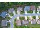 Aerial shot of neighborhood featuring many two-story homes with well-maintained lawns at 139 Vinca Cir, Suwanee, GA 30024