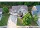 Aerial shot of a two-story home with a well-maintained lawn and long driveway at 139 Vinca Cir, Suwanee, GA 30024