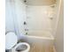 Standard bathroom with a tub-shower combo and white fixtures and toilet at 139 Vinca Cir, Suwanee, GA 30024