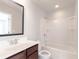 Bright bathroom with a combination tub and shower and modern vanity at 139 Vinca Cir, Suwanee, GA 30024