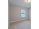 Neutral bedroom features carpet, natural light from a window, and a comfortable, inviting atmosphere at 139 Vinca Cir, Suwanee, GA 30024