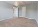 Neutral carpeted bedroom featuring modern light fixture and grey walls at 139 Vinca Cir, Suwanee, GA 30024