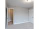 Neutral bedroom features carpet, an open closet, and a comfortable, inviting atmosphere at 139 Vinca Cir, Suwanee, GA 30024