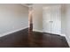 Neutral bedroom with double door closet and dark hardwood floors at 139 Vinca Cir, Suwanee, GA 30024