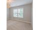 Bedroom featuring neutral walls and carpet, plus a modern light fixture at 139 Vinca Cir, Suwanee, GA 30024