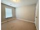 Simple bedroom with plush carpet, window with blinds and neutral paint at 139 Vinca Cir, Suwanee, GA 30024