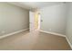 Cozy bedroom with carpet floors, neutral walls, and white trim at 139 Vinca Cir, Suwanee, GA 30024