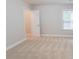 Neutral bedroom features carpet, natural light from a window, and an open closet at 139 Vinca Cir, Suwanee, GA 30024