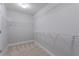 Spacious closet with overhead lighting, neutral walls and carpet, and ample wire shelving at 139 Vinca Cir, Suwanee, GA 30024