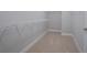 Neutral closet with wire shelving and carpeting provides ample storage space at 139 Vinca Cir, Suwanee, GA 30024