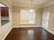 Bright dining area with hardwood floors, large window, and adjacent access to the back patio at 139 Vinca Cir, Suwanee, GA 30024