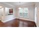Dining area with large windows, breakfast bar and hardwood floors at 139 Vinca Cir, Suwanee, GA 30024