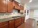 Kitchen with granite countertops, stainless steel appliances, a gas range, and hardwood flooring at 139 Vinca Cir, Suwanee, GA 30024