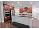 Stylish kitchen with stainless steel appliances, dark wood cabinetry, and granite countertops at 139 Vinca Cir, Suwanee, GA 30024