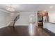Open-concept living space with hardwood floors and seamless flow to the kitchen at 139 Vinca Cir, Suwanee, GA 30024