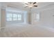 Large main bedroom with tray ceiling and neutral carpet at 139 Vinca Cir, Suwanee, GA 30024