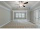 Large main bedroom with carpet, ceiling fan and tray ceiling at 139 Vinca Cir, Suwanee, GA 30024