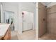 Bathroom/laundry room with tile shower and nearby laundry appliances at 2945 Ashbyrn Ct, Buford, GA 30519