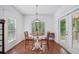Cozy breakfast nook area with hardwood floors, a round table, and abundant natural light at 2945 Ashbyrn Ct, Buford, GA 30519
