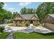 Charming home showcasing stone accents, manicured landscaping, and an inviting driveway at 2945 Ashbyrn Ct, Buford, GA 30519