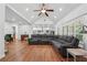 Spacious living room seamlessly connected to the kitchen, featuring hardwood floors and ample seating at 2945 Ashbyrn Ct, Buford, GA 30519