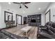Spacious living room with vinyl floors, built-in shelving, and a cozy seating area at 2945 Ashbyrn Ct, Buford, GA 30519