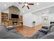 Inviting living room featuring a stone fireplace, hardwood floors, and ample seating at 2945 Ashbyrn Ct, Buford, GA 30519