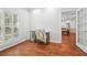 Bright office space with hardwood floors and natural light, view into adjacent dining room at 2945 Ashbyrn Ct, Buford, GA 30519