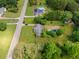 Expansive aerial view showcasing the home, large lot and inground pool needing some TLC, surrounded by lush trees at 315 Pleasant Grove Rd, Mcdonough, GA 30252