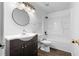 Bathroom with vanity, toilet, and shower-tub combo at 315 Pleasant Grove Rd, Mcdonough, GA 30252