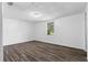 Comfortable bedroom featuring wood-look flooring and neutral walls at 315 Pleasant Grove Rd, Mcdonough, GA 30252