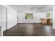 Open living area with new flooring, natural light, and potential for customization at 315 Pleasant Grove Rd, Mcdonough, GA 30252