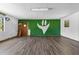 Spacious living area with modern flooring and uniquely painted wall for a modern look at 315 Pleasant Grove Rd, Mcdonough, GA 30252