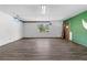 Large living room featuring new flooring, natural light, and customizable space at 315 Pleasant Grove Rd, Mcdonough, GA 30252