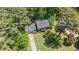 Aerial view highlighting a home with lush landscaping, a private driveway, and surrounding trees at 3287 Alton Rd, Atlanta, GA 30341