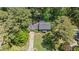 Aerial view showcasing a home with mature trees, manicured lawn, and inviting curb appeal at 3287 Alton Rd, Atlanta, GA 30341