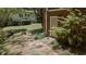 A lovely walkway surrounded by lush greenery leading to a home addition and backyard at 3287 Alton Rd, Atlanta, GA 30341