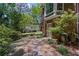 A lovely walkway surrounded by lush greenery leading to a home addition and backyard at 3287 Alton Rd, Atlanta, GA 30341