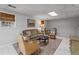 Basement area with neutral sofa, area rug, and well lit at 3287 Alton Rd, Atlanta, GA 30341
