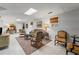 Basement area with light grey walls and tile floors, features comfortable seating at 3287 Alton Rd, Atlanta, GA 30341