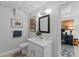 Bathroom featuring a vanity, toilet, mirror, and natural lighting at 3287 Alton Rd, Atlanta, GA 30341