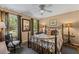 Cozy bedroom features a metal bed frame, neutral walls, and a ceiling fan at 3287 Alton Rd, Atlanta, GA 30341