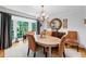 Inviting dining room with a bay window, elegant chandelier, and stylish decor, perfect for hosting gatherings and Gathering meals at 3287 Alton Rd, Atlanta, GA 30341