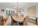 Open dining room and chandelier with easy access to multiple living spaces at 3287 Alton Rd, Atlanta, GA 30341