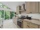 Well-equipped kitchen featuring granite countertops, stainless steel appliances, and a sun-drenched breakfast area with scenic views at 3287 Alton Rd, Atlanta, GA 30341