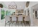 Open-concept kitchen with island seating, granite countertops, and stunning backyard views at 3287 Alton Rd, Atlanta, GA 30341