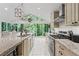 Modern kitchen with stainless steel appliances, ample counter space, and beautiful views of nature at 3287 Alton Rd, Atlanta, GA 30341